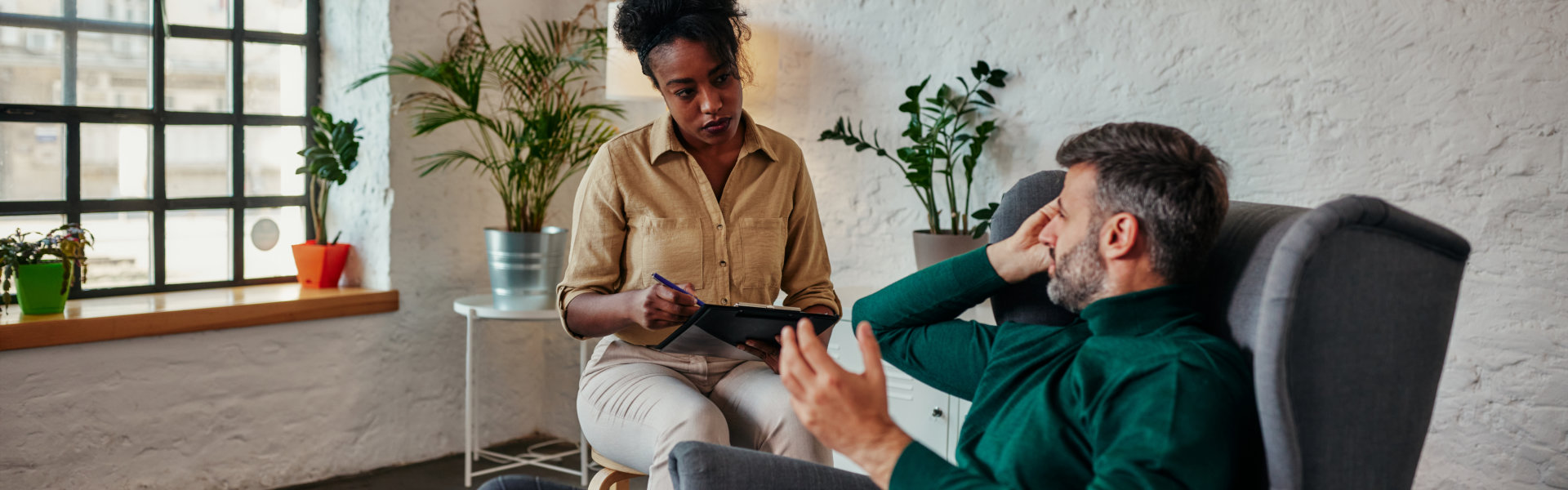 consultant talking to an elderly