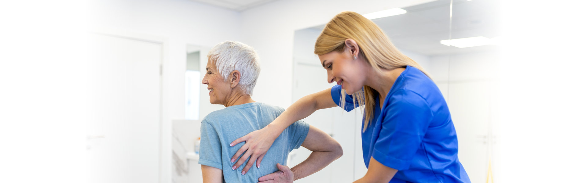 doctor helping a patient with back pain
