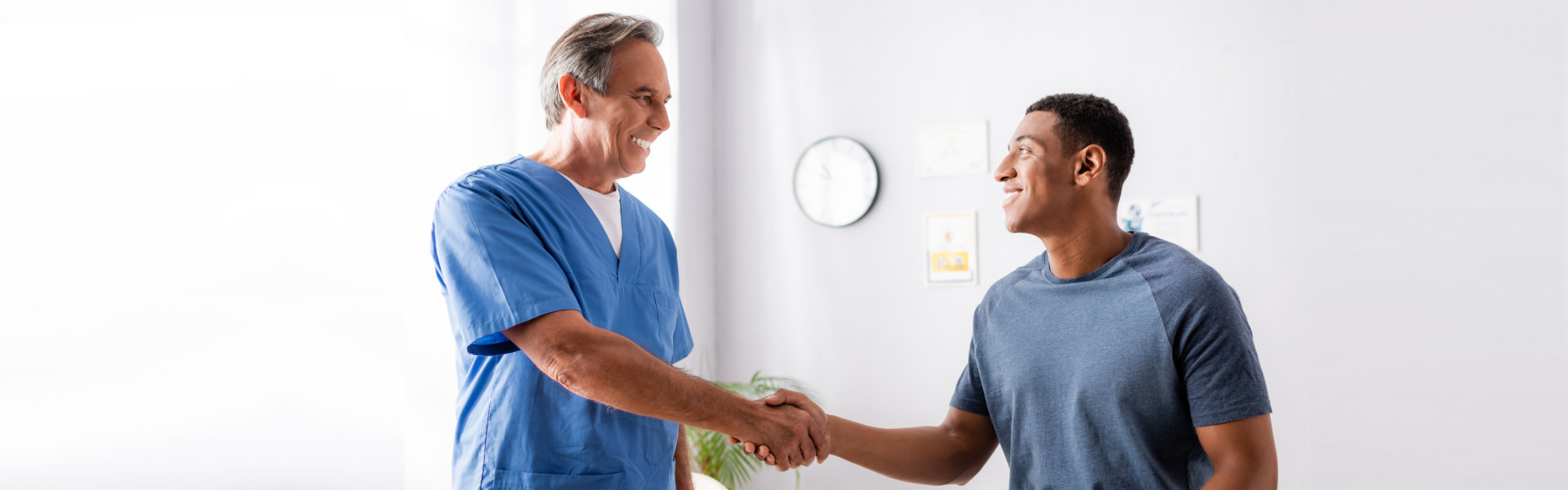patient shaking hands with doctor