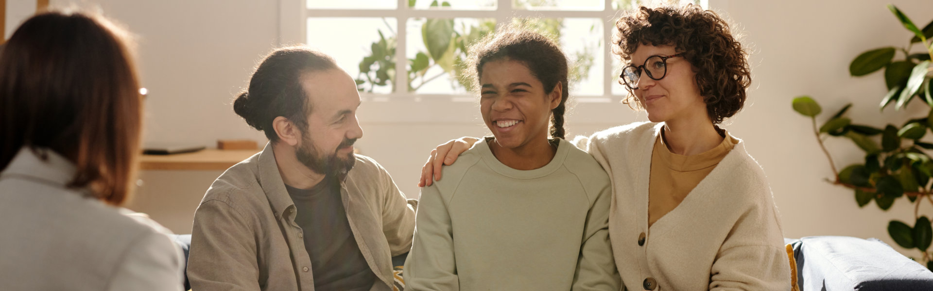 family talking to therapist