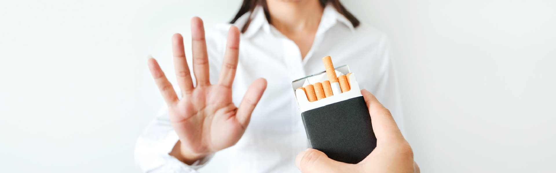 woman refusing cigarettes