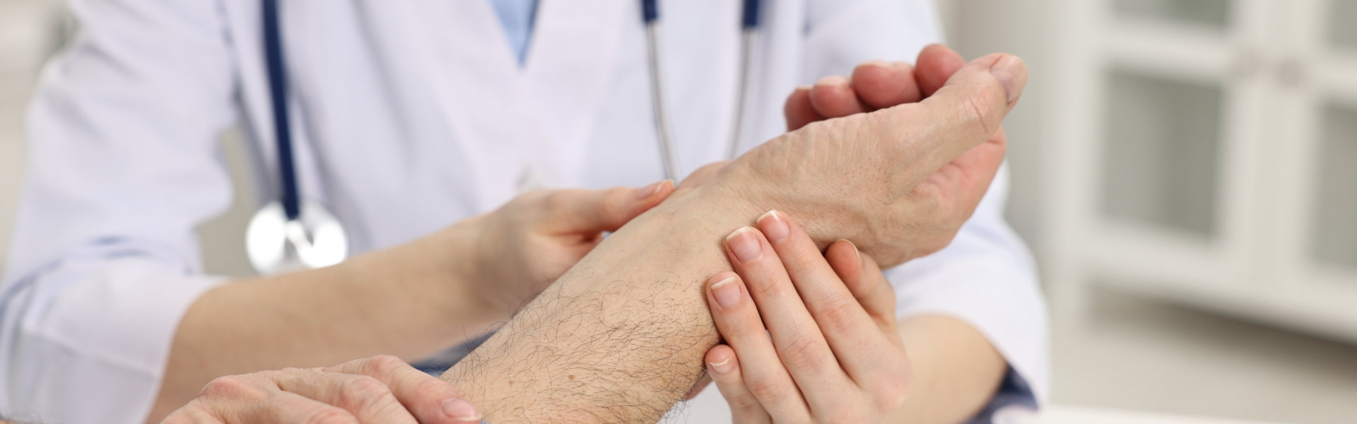 doctor checking a patient's wrist
